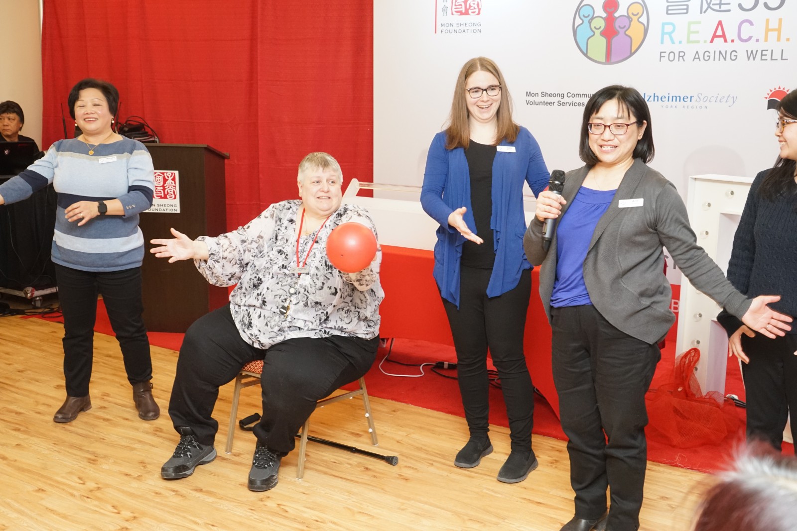 Facilitators from Alzheimer Society of York Region demonstrating the Minds in Motion exercise